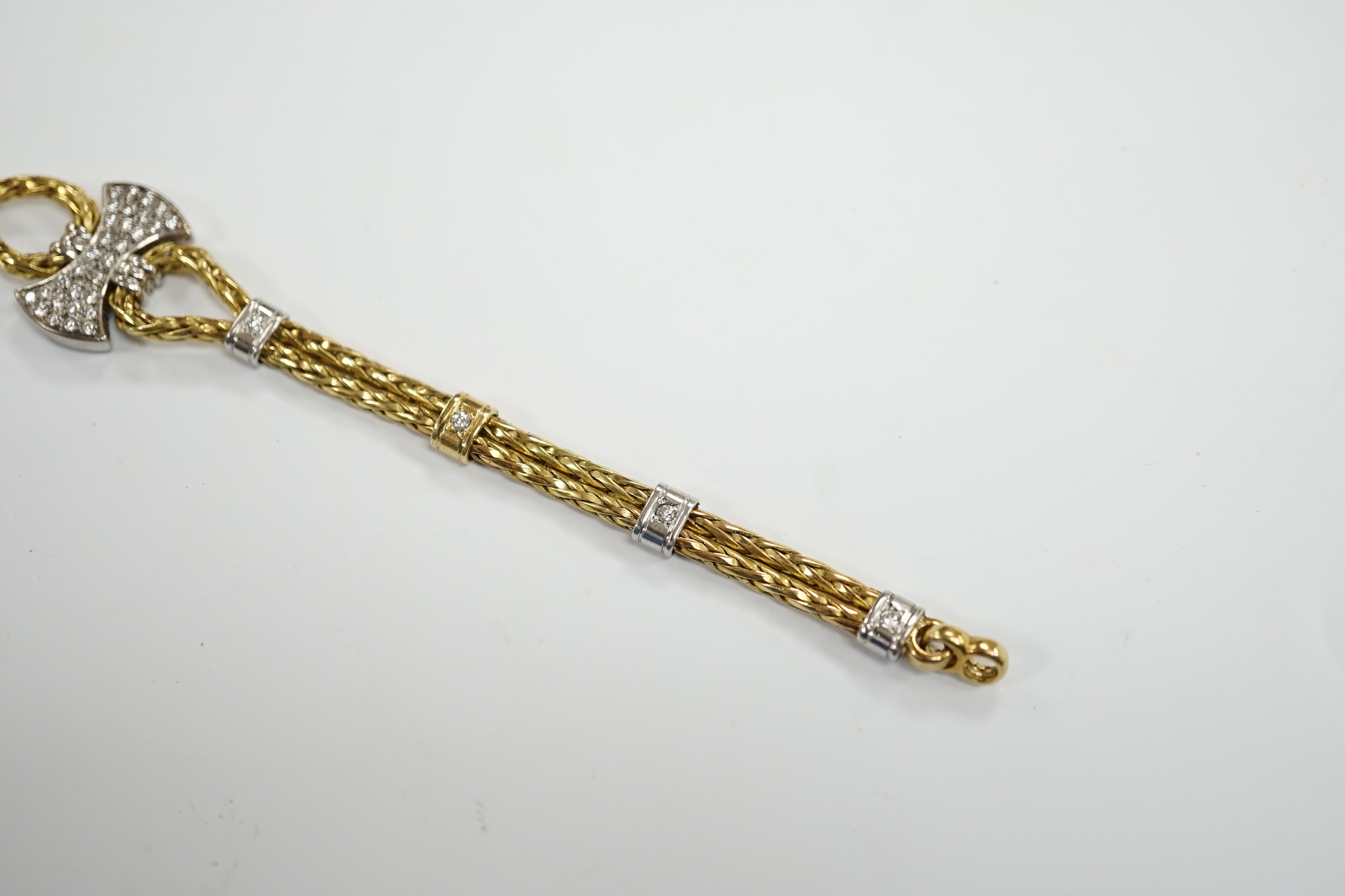 A modern 750 yellow metal and diamond cluster set bracelet, 21.5cm, gross weight 33.9 grams.